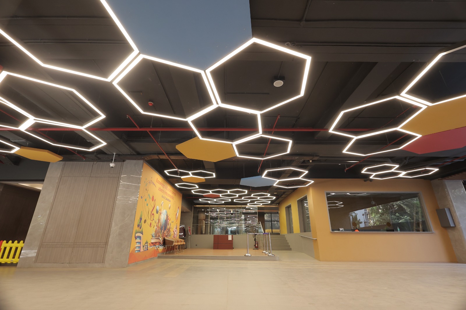 Hexagon-lit atrium lobby at Bunts Sangha School, Borivali, Mumbai
