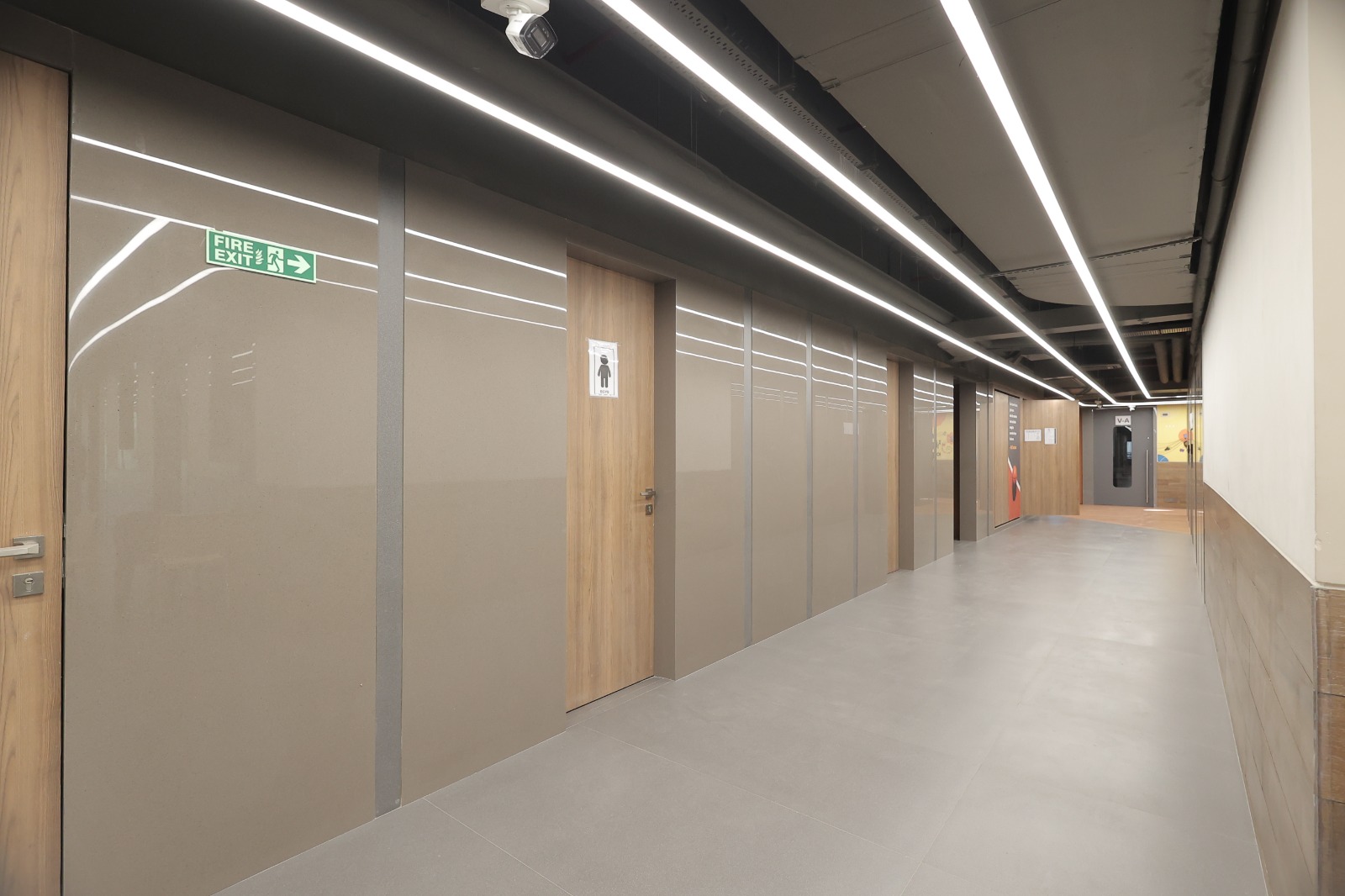 Glossy corridor with linear lighting at Bunts Sangha School, Borivali